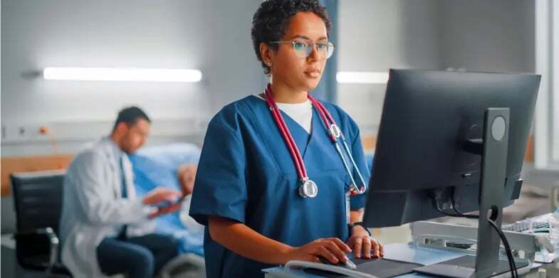 A doctor launches an interpreting session from the EHR while meeting with a patient.